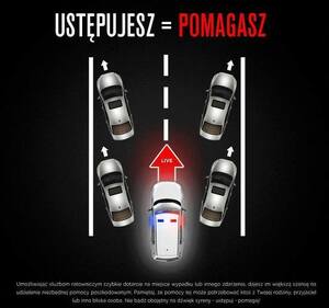 obrazek jadących samochodów, które rozjeżdżają się na boki, bo środkiem jedzie radiowóz z włączonymi sygnałami świetlnymi