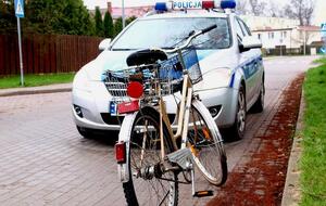 rower na tle radiowozu